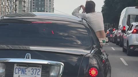 Passenger Takes Selfies While Stuck in Traffic