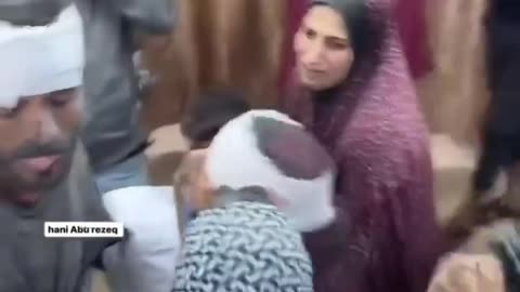 This is Pallywood: Camera crew, bandage over hijab, everybody going wild.