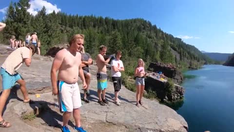 Guy Hits Water With His Face First While Jumping Off Of Cliff