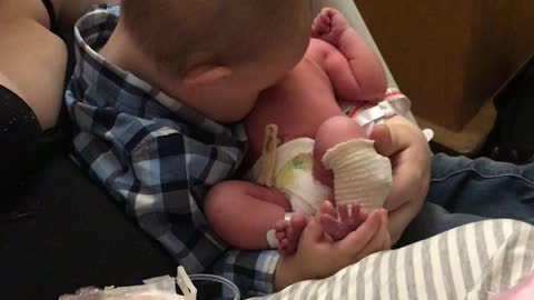 Big Brother and Little Sister Share Precious Moment