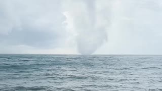 Beautiful Tornado Comes From the Ocean and Crashes into Shoreline