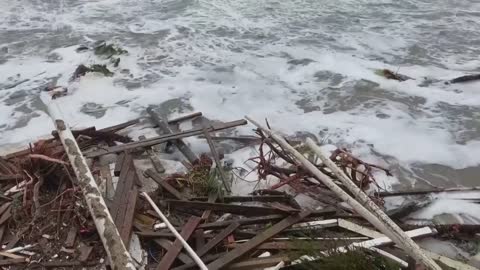 Tropical Storm Nicole topples beachfront homes