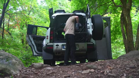 Light self driving camping in summer, listening to the sound of water flow at the river valley, enjo