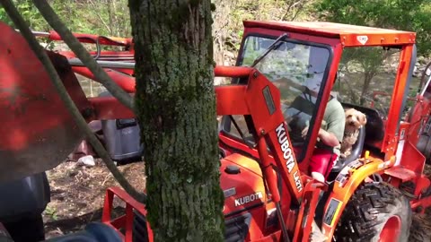 Daniel hoisting the quad with the kubota B7300 tractor.