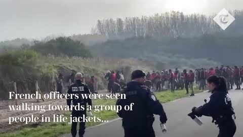 Migrants in life jackets throw rocks at French police to get to dinghies for Channel crossing