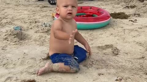 Cute kids are playing on the beach. Funny Baby Game!