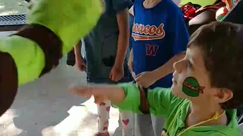 Raphael shows how to get pizza from ice cream kitty freezer at colonial park in West University