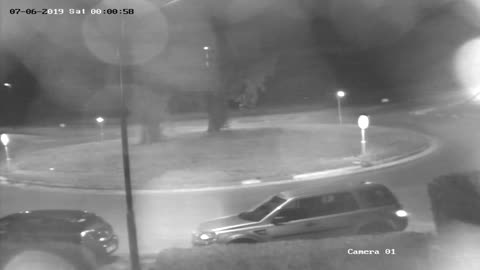 Fleeing Car Flies Over Roundabout