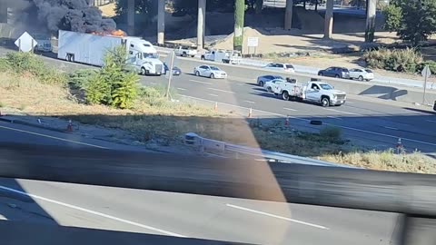 Semi-Truck Full of Monster Trucks on Fire