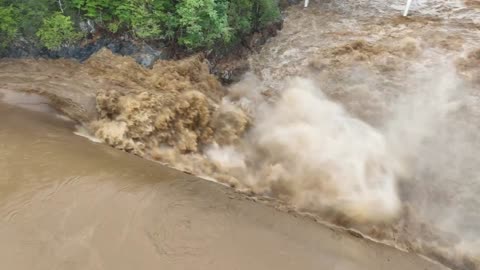 Water overflows the Nolichucky Dam In Tennessee