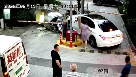 Car knocks down booth with security guard