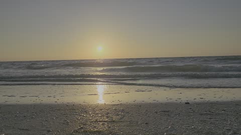 RELAXING BEACH SUNSET ROLLING WAVES GOLDEN SUN WHITE CAPS GULF OF MEXICO