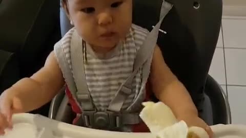 Baby first eat the bananas