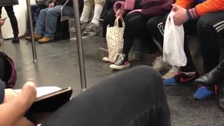 Old man black fanny pack pull ups on subway