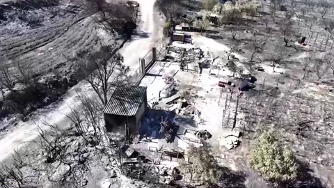 Drone footage shows aftermath of wildfire in Athens suburbs