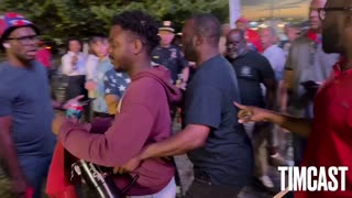 🚨A black Trump supporter (in the Harvard hoodie) is physically confronted by Haitians for Harri