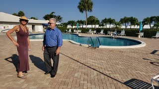 Tatiana and Richard by the swimming pool