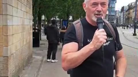 Brother Kieran preaching the Gospel at the gay pride parade in Manchester