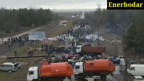 Ukrainians block Russian troops from a nuclear plant in Enerhodar