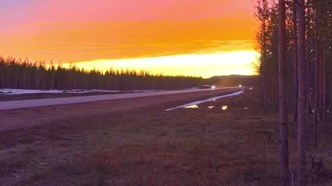 Swedish JAS-39 Gripen takes off in the glow of sunset