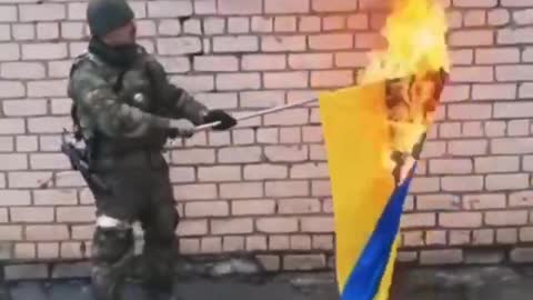 DPR/LPR Soldier Burning Ukraine Flag