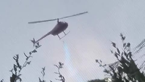 Helicopter sprays blue chemical over house in Florida