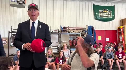 Joe Biden wears a Trump hat as the Pennsylvania crowd cheers.