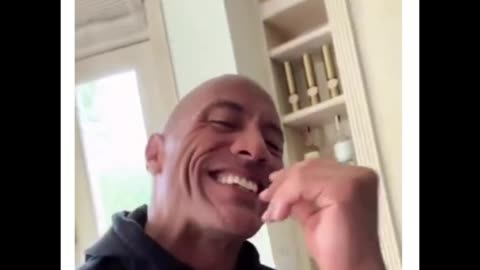 Dweyne "The Rock" Johnson talking to his dog