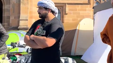 Woman wearing an Israeli scarf walks around Sydney University campus