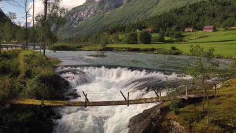 suspension bridge over the mountain river beautiful nature norway natural landscape