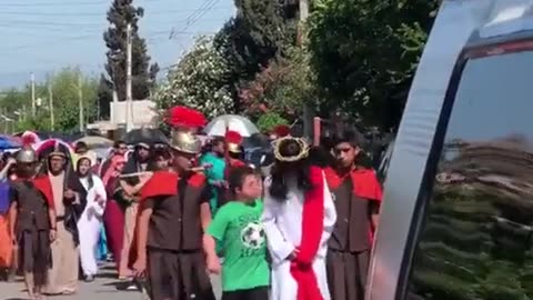 Flashback: Boy With Down Syndrome Comforting Jesus During a Good Friday Procession In Mexico