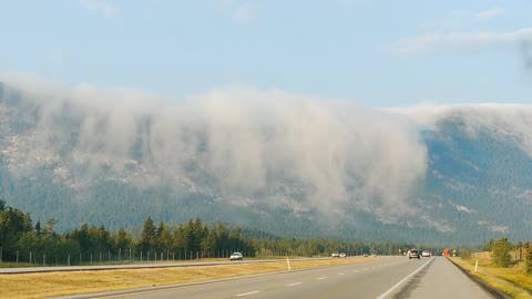 A Waterfall of Clouds in the Mountains