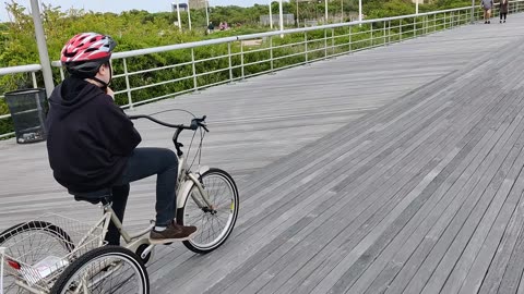 Spencer riding his tricycle at Jones beach air show VID_20230521_132721