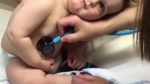 Sweet baby boy rest head on nurse hand