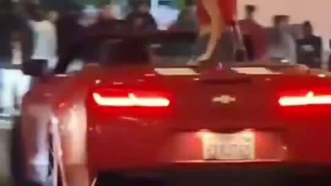 instant regret- chick rides on back of car going sideways.