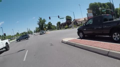 Lucky Rider Survives Red Light Runner