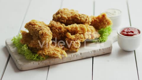 Fried meat laid on chopping board