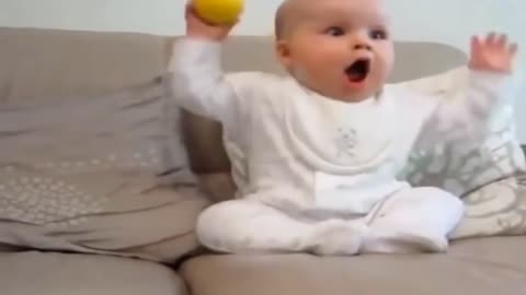 the cuteness of a baby playing ball with his father Live translation