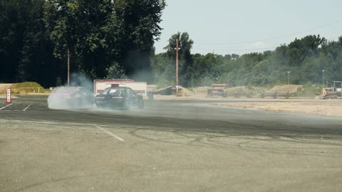 Two Cars Drifting on the Race Track