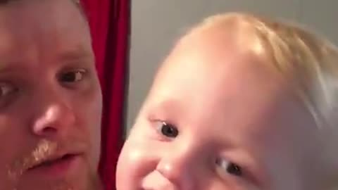 Baby preciously says "I love you" to camera