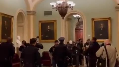 Journo View of DC Cop Eugene Banks Pretending Not To Be Letting People Into The Capitol Building on Jan6