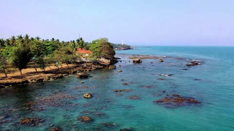 LIGHTHOUSE AND COREL REEF. SUN SEA AND BEACH MUSIC