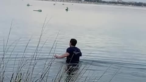 Guy Jumps Into Ice Water To Save Deer With Bucket Stuck On Her Head