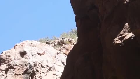 Girl does dangerous dive into slot canyon