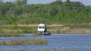 Amphibious vehicle for oil spill recovery and cleanup