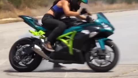 Girl bike stunt