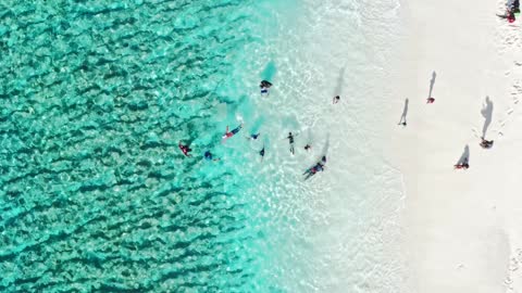 Beach front with children playing