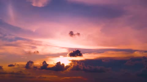 A Mesmerizing Sunset with Majestic Clouds Passing By