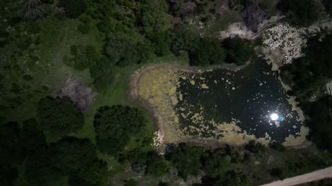 Solar Eclipse 2024 April reflected in pond from Drone