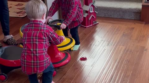 Twin Boys Toss Their Toys in Excitement